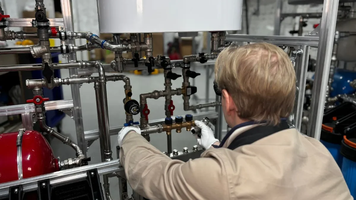 Plumber Inspecting Geyser